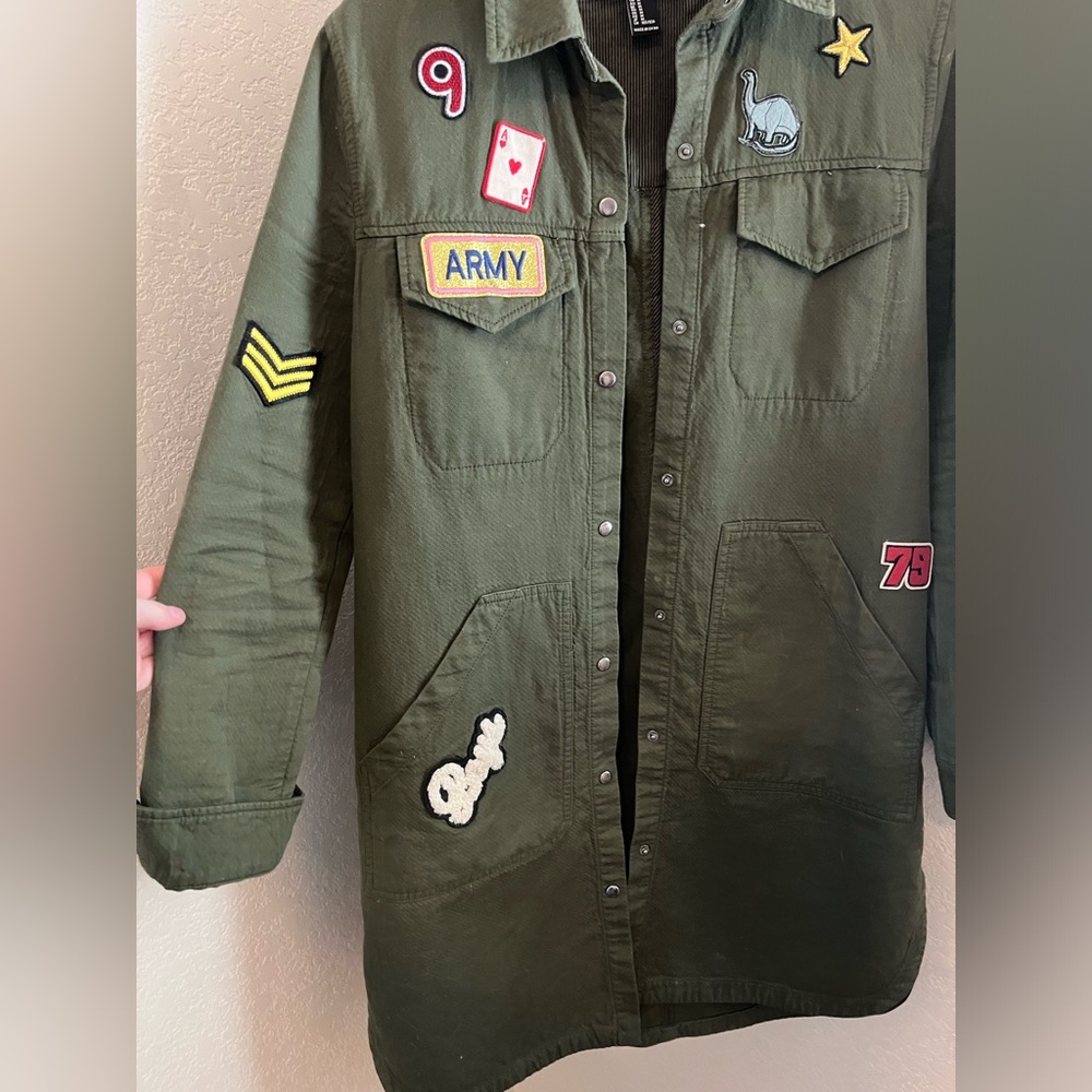 Long green army style jacket with fun patches